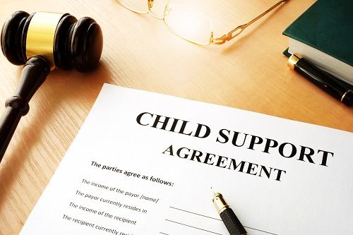 Child Support Agreement paper with pen and gavel